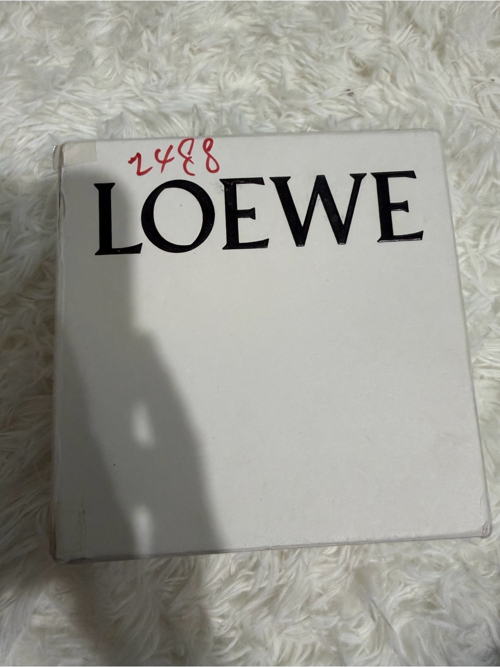 Loewe Black Logo on White Box with Red Marking